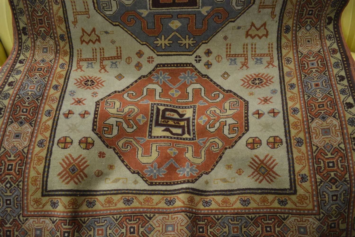 20th Century Caucasian design rug with triple medallion on ivory ground