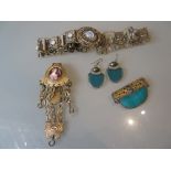 Gilt metal chatelaine, moonstone inset belt, green glass panel brooch and a pair of similar earrings