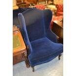 Pair of reproduction blue velvet upholstered wing armchairs on cabriole supports Good condition,