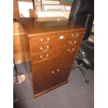 Mahogany canteen cabinet having three drawers above two flush panelled doors on plinth base