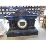 19th Century black slate and gilt metal mounted mantel clock, the architectural case with enamel