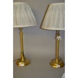 Pair of adjustable brass table lamps with shades