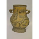 Large Chinese bronze two handled vase relief decorated with dragons, signed with seal mark to