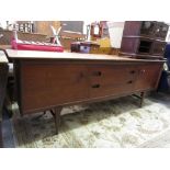 Younger and Son Ltd 1960's teak sideboard having central drawers with two cupboards on shaped