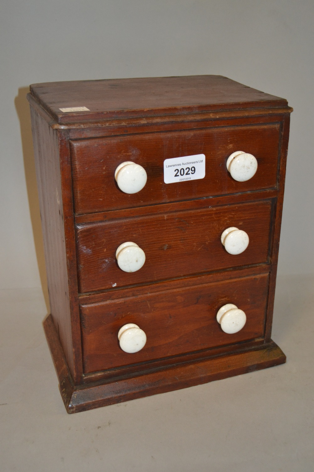 19th Century miniature three drawer table top chest with white ceramic handles