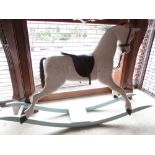 20th Century white painted rocking horse on a green painted base