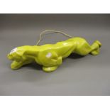 Art Deco yellow glazed pottery table lamp in the form of a stalking panther, 19.5ins long No signs