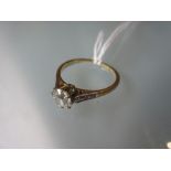 18ct Yellow gold and platinum set solitaire ring with chip set shoulders From visual inspection