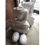 Pair of Oriental white marble carved figures of seated Buddha (heads broken), 16.5ins high each