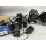 Mamiya cine camera with double lens and extra double lens, Konica 135mm lens, Cosina SLR camera