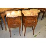 Pair of French kingwood floral marquetry inlaid three drawer bedside cabinets with rouge marble tops