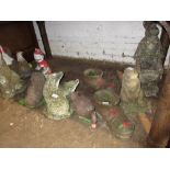 Group of ten various weathered cast concrete partially painted figures of animals etc.