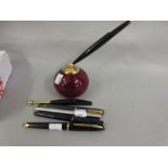 Waterman fountain pen with an 18ct gold nib together with a Parker pen stand and a quantity of other
