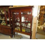 Late Georgian mahogany bookcase top on a later stand, with a moulded dentil cornice above two