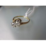 Yellow gold two stone diamond crossover ring One stone is slightly chipped at the girdle and it is