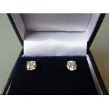 Pair of 18ct white gold solitaire stud earrings approximately 0.65ct total
