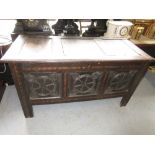 17th Century oak and inlaid coffer, the hinged cover above carved three panel front raised on
