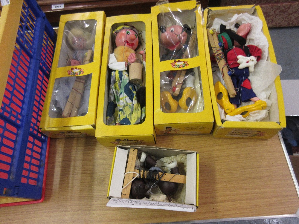 Two boxed Pelham puppets, Mickey Mouse and Goofy, with three further boxed puppets, Old Lady,