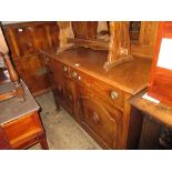 Early 20th Century Arts and Crafts oak sideboard with a mirrored back above two drawers and two