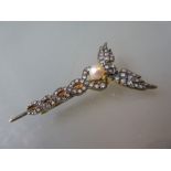 Caduceus style brooch set diamonds and a cultured pearl Of recent manufacture. Good condition.