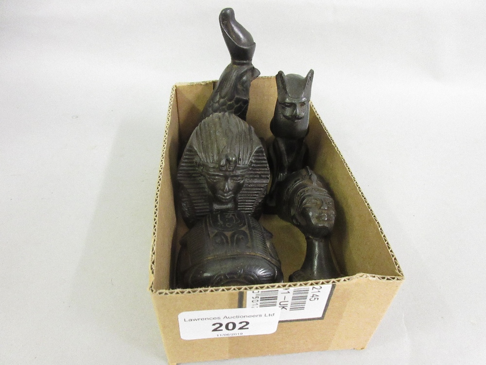 Five small black basalt type Egyptian figures together with two small carved bone figures of lions