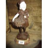 Reproduction bronze and ivorine figure of a girl carrying a basket of flowers after Chiparus, 10.