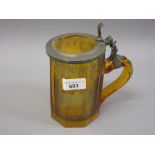 19th Century Bohemian amber overlaid clear glass tankard, etched with buildings (hinge at fault)