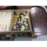Large folding wooden chess and backgammon board, with late 19th or early 20th Century chess pieces