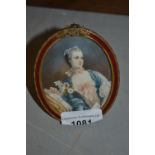Oval framed miniature portrait of a seated lady, housed in a gilt metal frame
