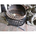 Two large iron fire grates