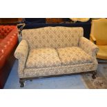 1920's Floral upholstered sofa raised on mahogany carved cabriole claw and ball front supports