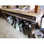Indian hardwood iron studded dining table on turned supports with two end drawers, together with a
