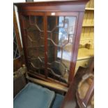 20th Century mahogany floor standing corner cabinet, having moulded cornice above two bar glazed