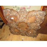 Early 20th Century floral carved wooden occasional table on folding base