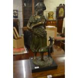 20th Century patinated bronze figure of a lady in green dress holding a crop with a goat at her feet