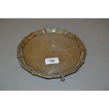 London silver circular salver on claw and ball supports, makers mark M.J.J., 8ins diameter