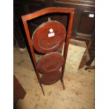 Edwardian mahogany three tier folding cakestand and a 20th Century mahogany framed firescreen with