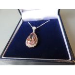 Rose gold pendant set large morganite stone and diamonds on a 9ct white gold chain, the morganite