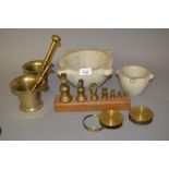Two bronze pestles and mortars, two marble mortars, two brass lenses and a graduated set of brass