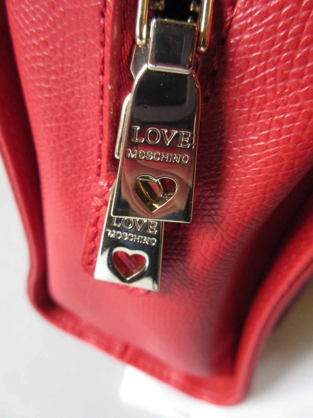 Love Moschino, red leather handbag having pocket to front with silver metal padlock style clasp - Image 3 of 4