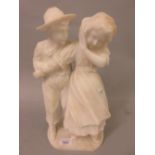 Carved alabaster group of a boy and girl, 15ins high