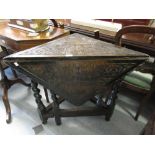 Victorian carved dark oak drop-leaf corner table on barley twist supports with stretchers