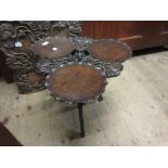 Carved hardwood cakestand with floral decoration on folding carved base