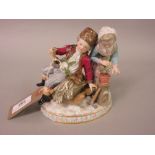 19th Century Meissen group of a seated woodman and wife on an oval base (with damages)