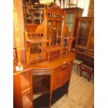 Late Victorian walnut chiffonier in Aesthetic style with a mirrored shelf back above a drawer,