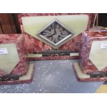 Art Deco red marble and green onyx mantel clock with metal mounts, the diamond shaped silvered