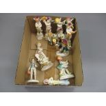 Set of five Continental porcelain figures of cherub musicians, a pair of similar smaller figures and