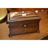 19th Century rosewood sarcophagus shaped tea caddy, the hinged cover enclosing a three division