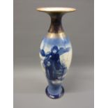 Large Royal Doulton Blue Children baluster form vase decorated with a figure in a winter