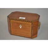 George III octagonal mahogany and inlaid tea caddy with lion mask ring handles